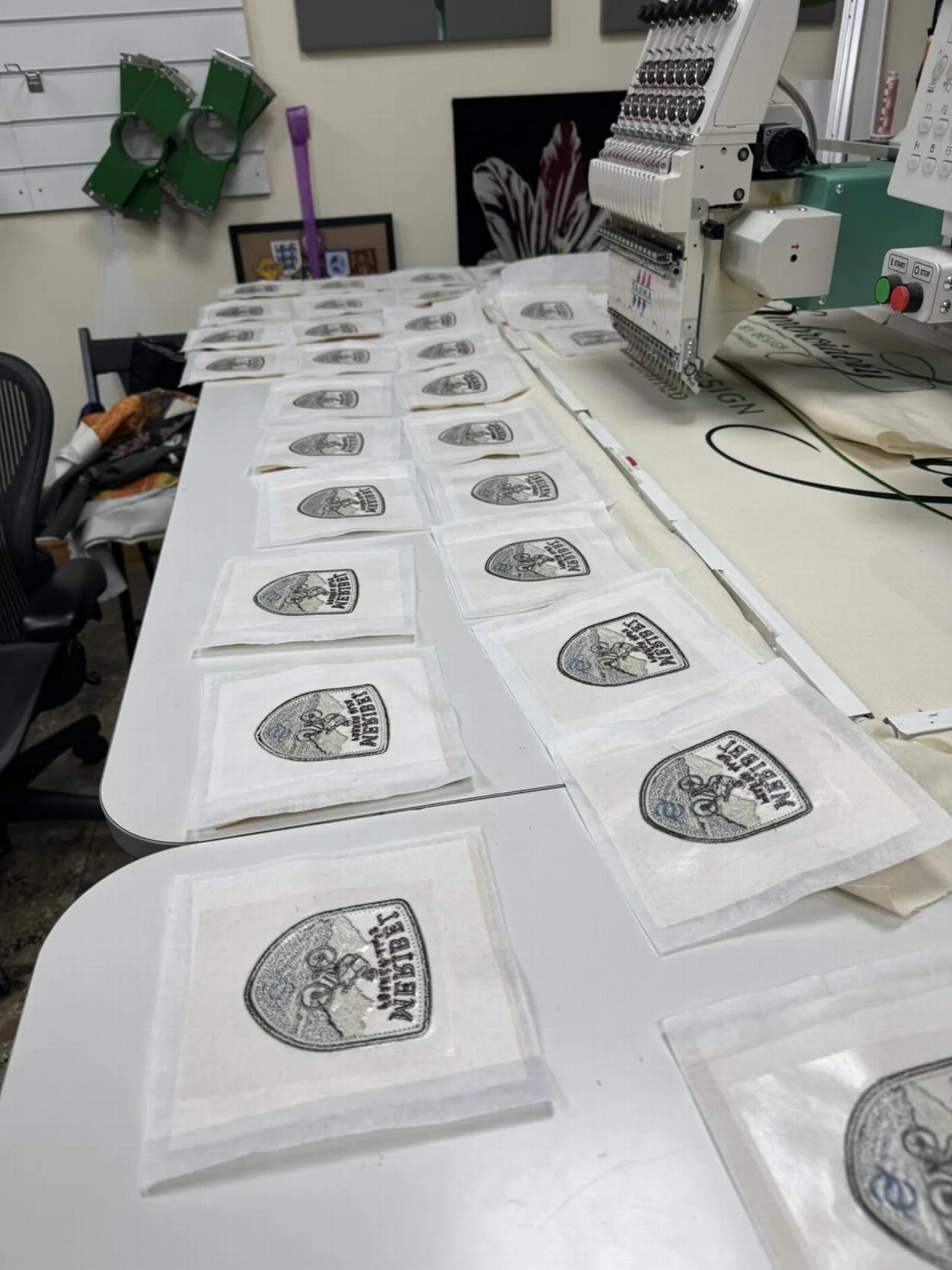 Production of embroidered badges in the EBD workshop