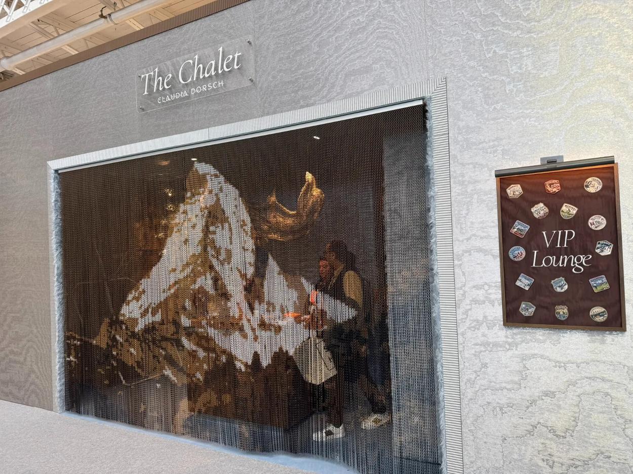 The Chalet entrance with tapestry and embroidered VIP Lounge display
